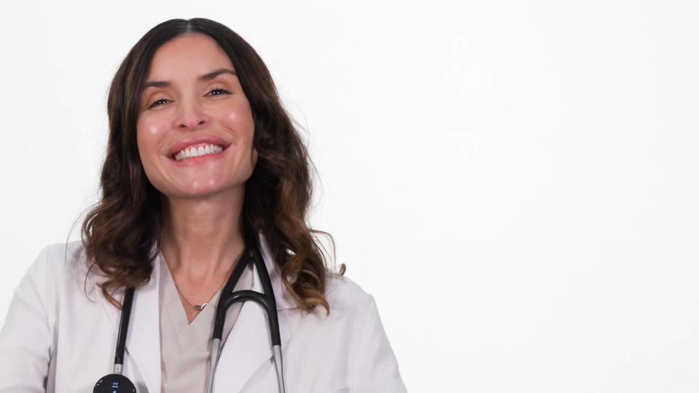 Dr. Natalia welcoming a patient to Wellness